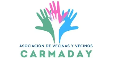 Logotipo de la Asociación de Vecinas y Vecinos Carmaday en La Vall d'Uixó con manos en diferentes colores simbolizando la comunidad.